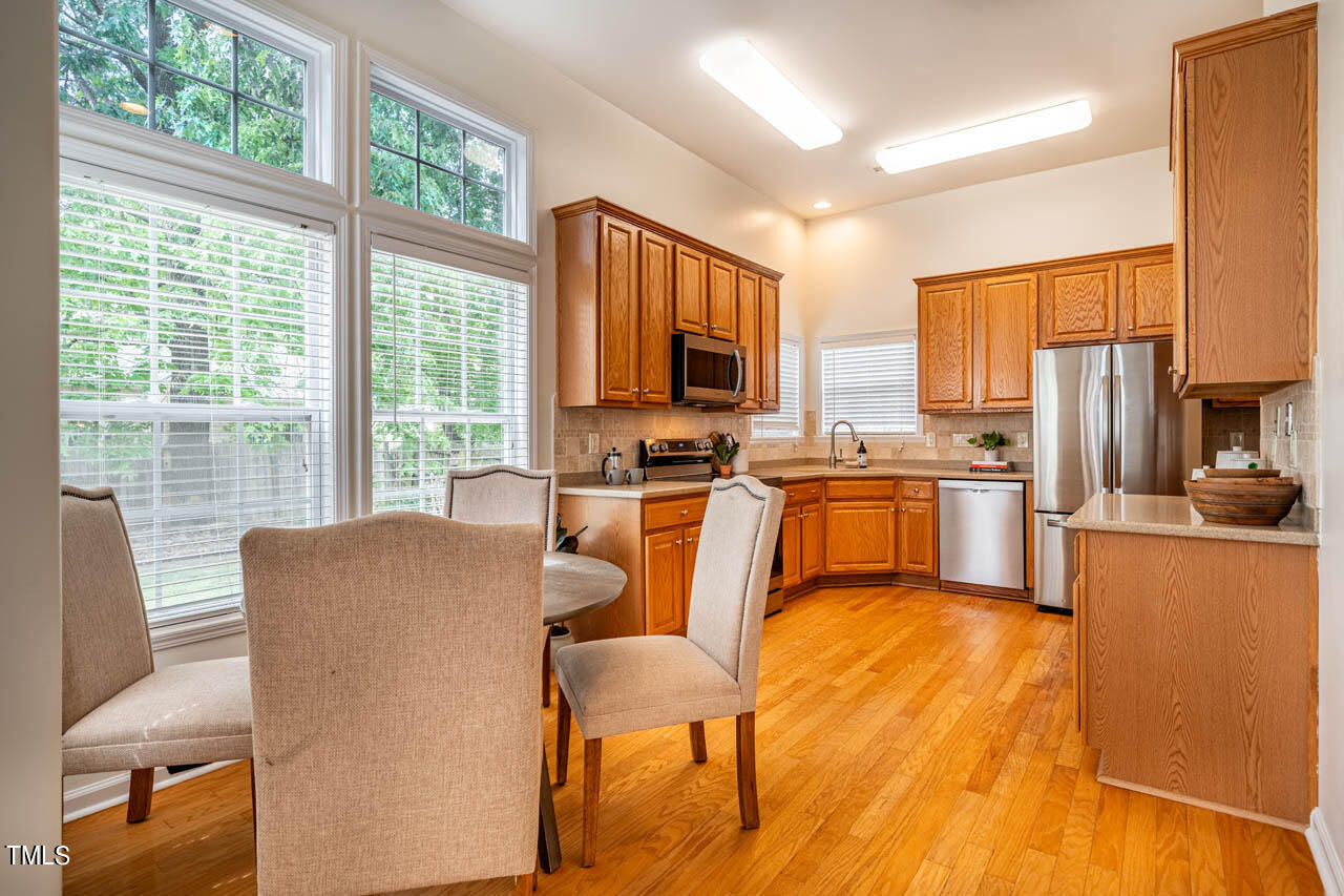 1314 Mallory Lane Durham, NC 27713 - Photo 16 of 47 a living room with stainless steel appliances furniture windows and a kitchen view