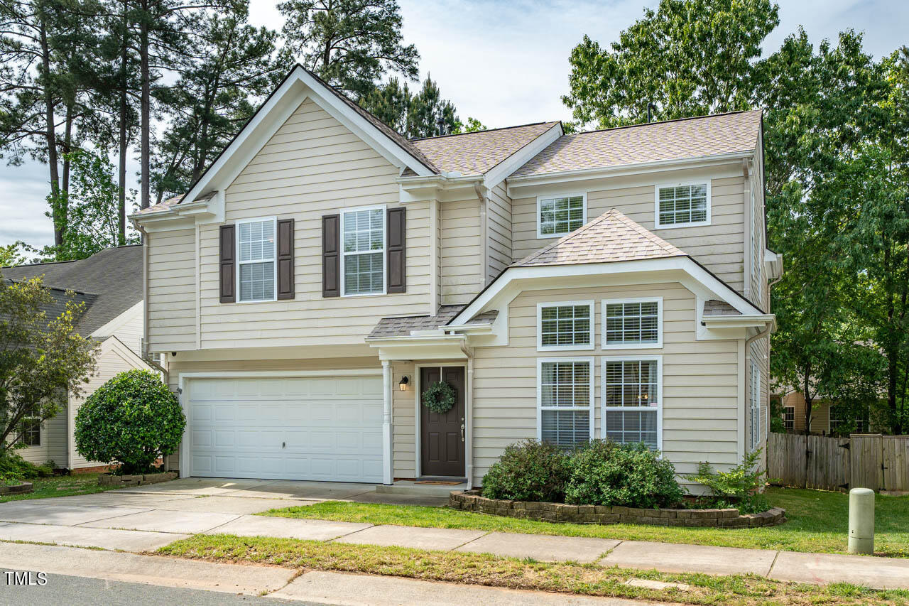 1314 Mallory Lane Durham, NC 27713 - Photo 2 of 47 a front view of a house with a yard and garage