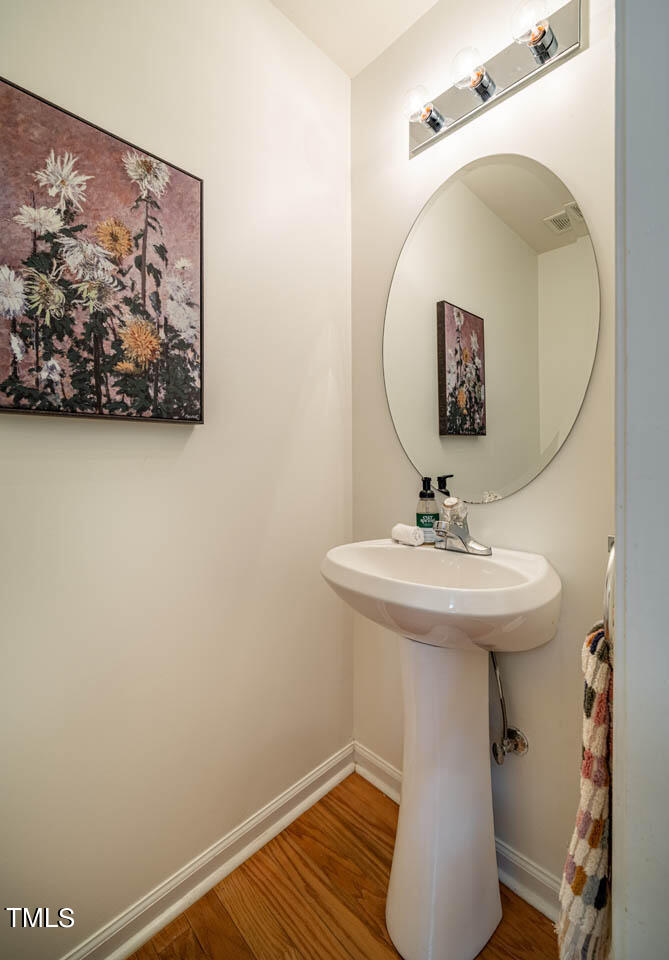 1314 Mallory Lane Durham, NC 27713 - Photo 23 of 47 a bathroom with a sink and mirror