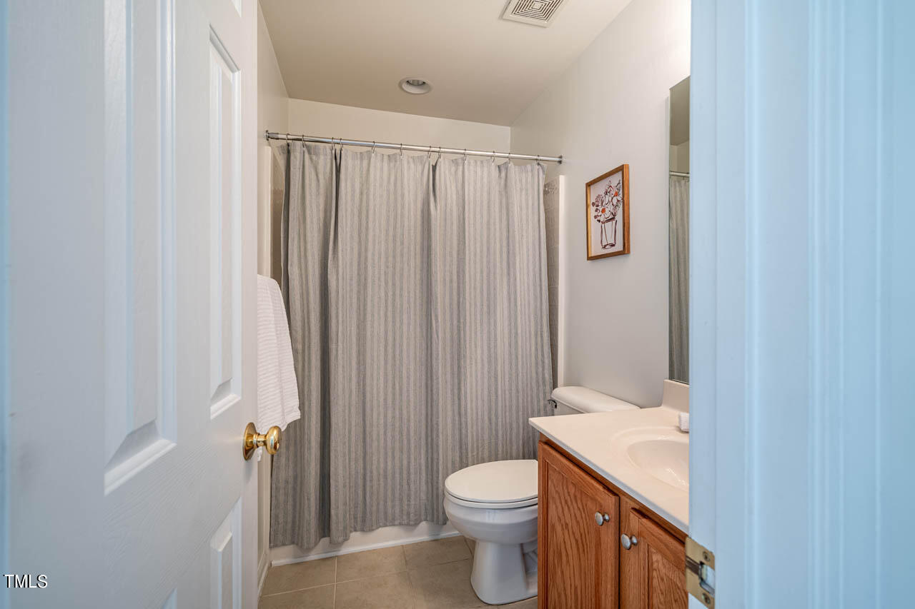 1314 Mallory Lane Durham, NC 27713 - Photo 25 of 47 a bathroom with a granite countertop sink toilet and shower