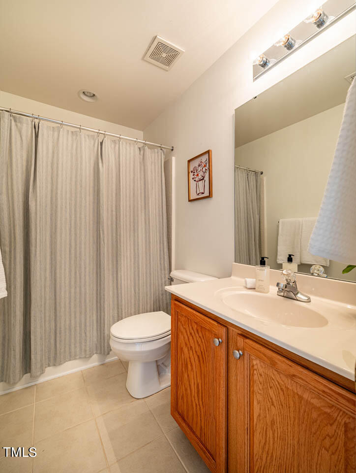 1314 Mallory Lane Durham, NC 27713 - Photo 26 of 47 a bathroom with a sink a toilet and a mirror