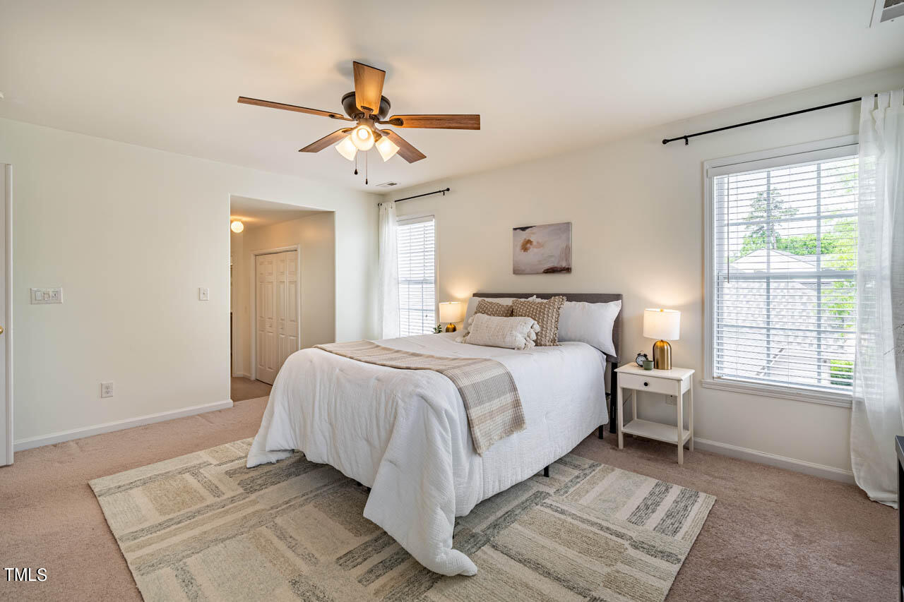 1314 Mallory Lane Durham, NC 27713 - Photo 29 of 47 a bedroom with a large bed and a window