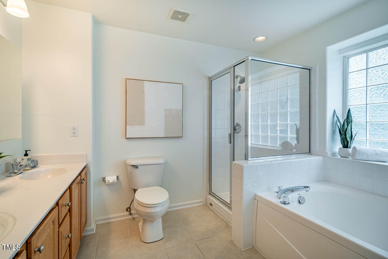 1314 Mallory Lane Durham, NC 27713 - Photo 31 of 47 a bathroom with a toilet a sink and a bathtub