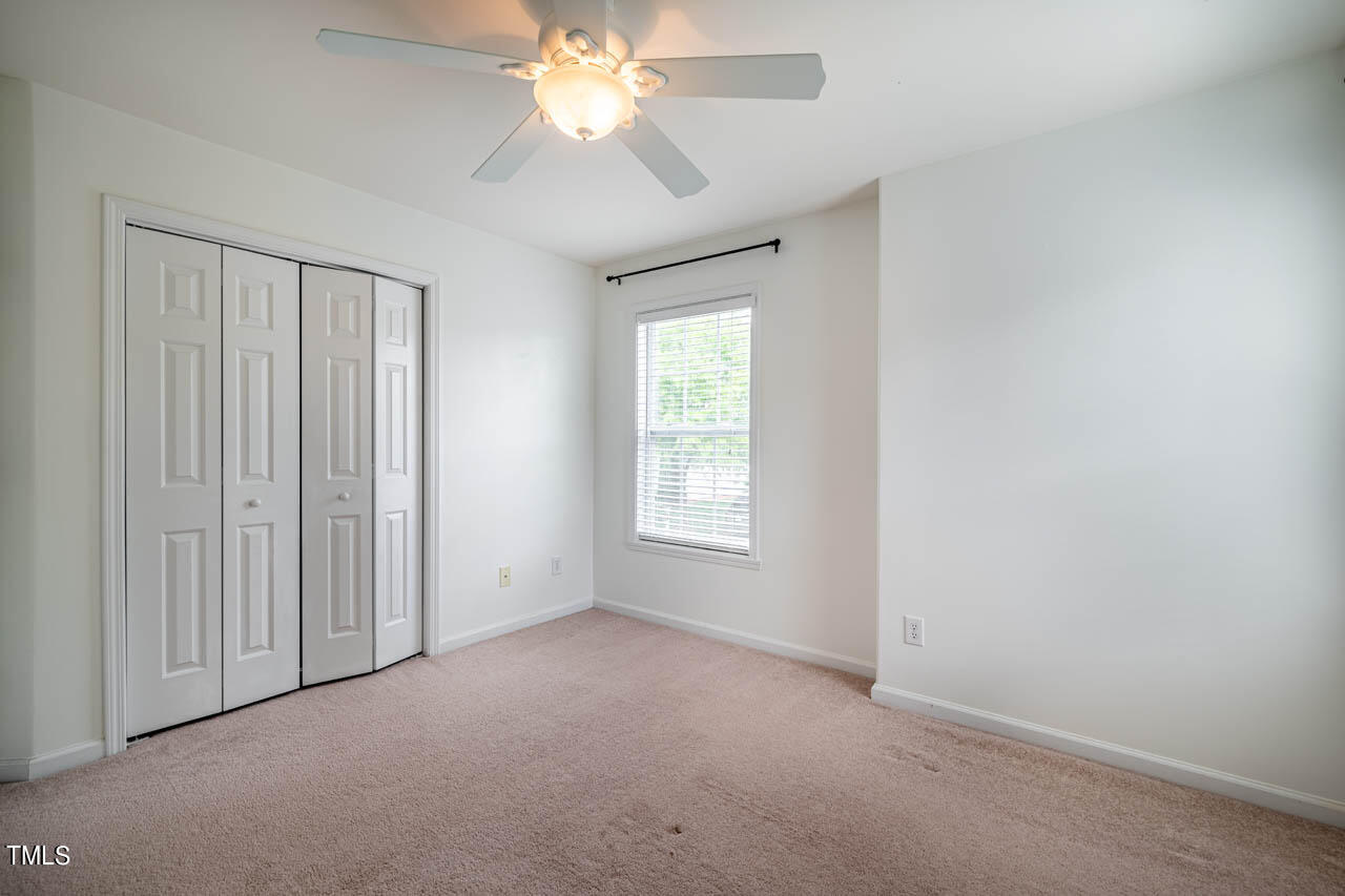 1314 Mallory Lane Durham, NC 27713 - Photo 38 of 47 an empty room with windows and fan