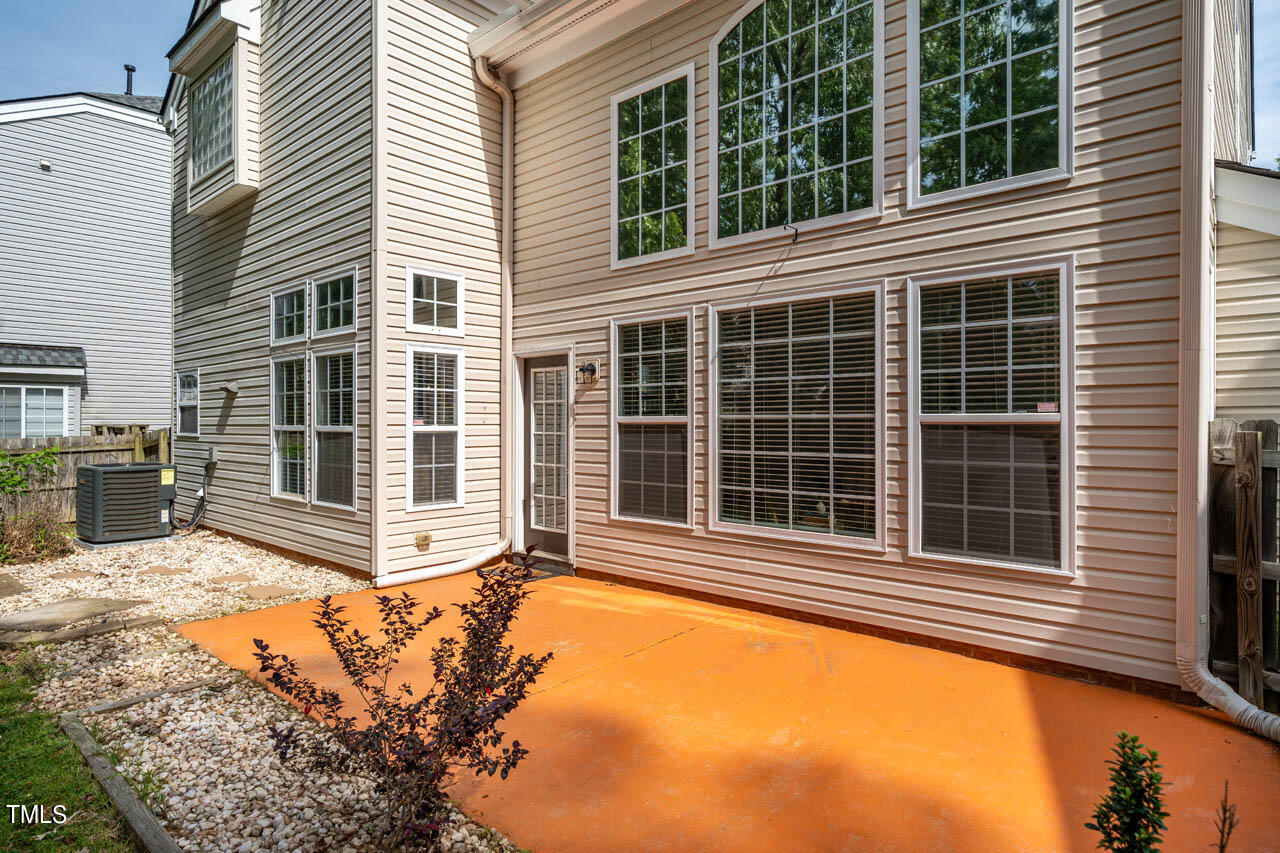 1314 Mallory Lane Durham, NC 27713 - Photo 42 of 47 a view of a house with a large window and wooden fence