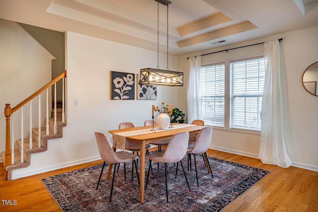 1314 Mallory Lane Durham, NC 27713 - Photo 10 of 47 a view of a dining room with furniture window and wooden floor