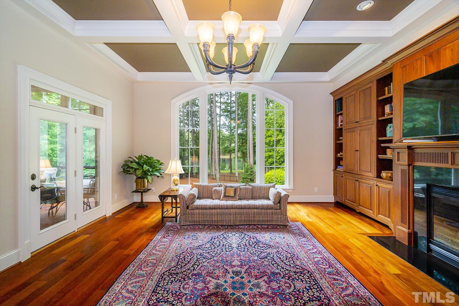 7128 Trenton Ridge Court, Unit 26 Raleigh, NC 27613 - Photo 12 of 30 a living room with patio furniture and a large window