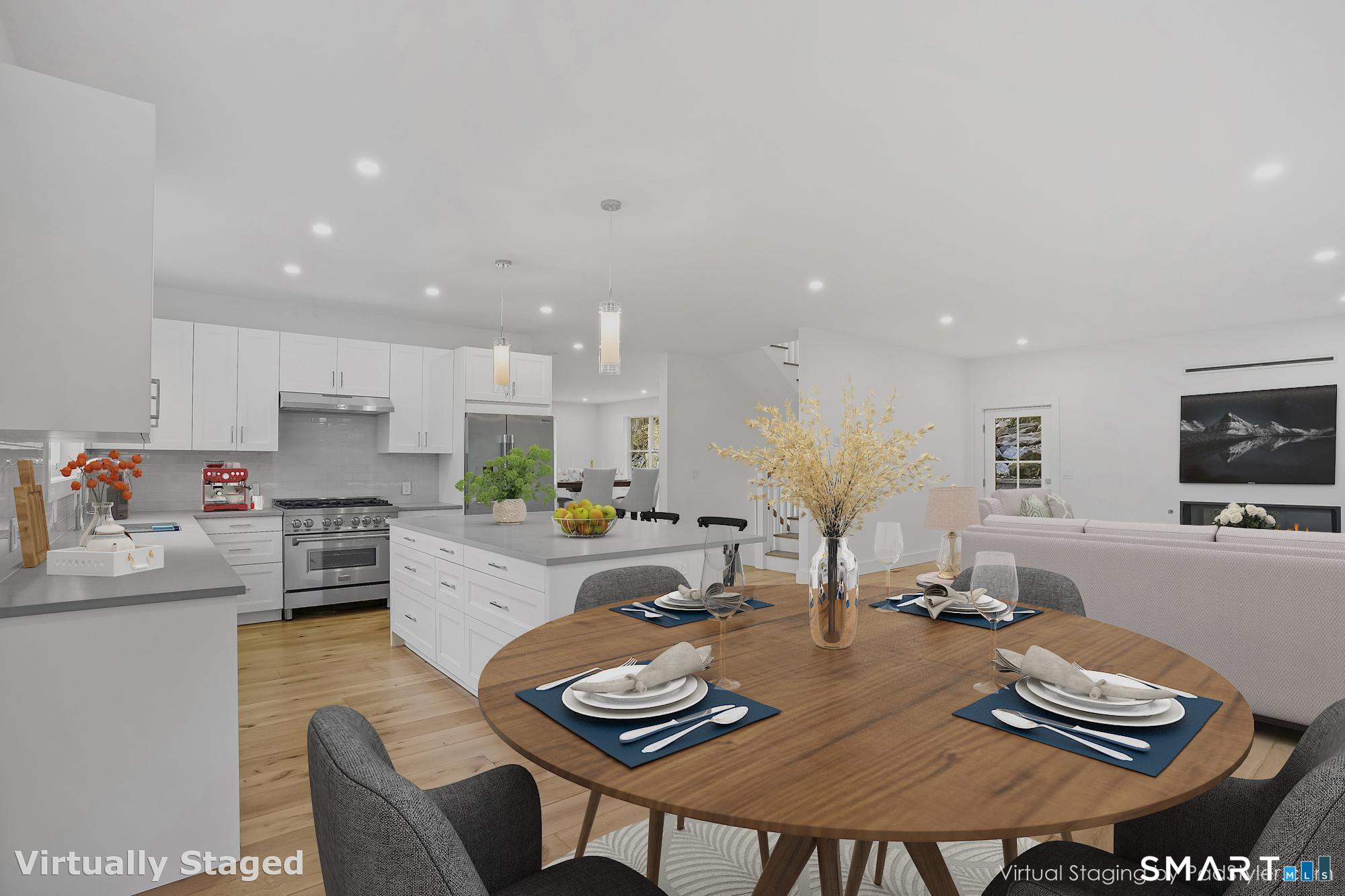 309 South Britain Road Southbury, CT 06488 - Photo 5 of 25 Kitchen and family room with engineered wood flooring shown from the eating area of the kitchen