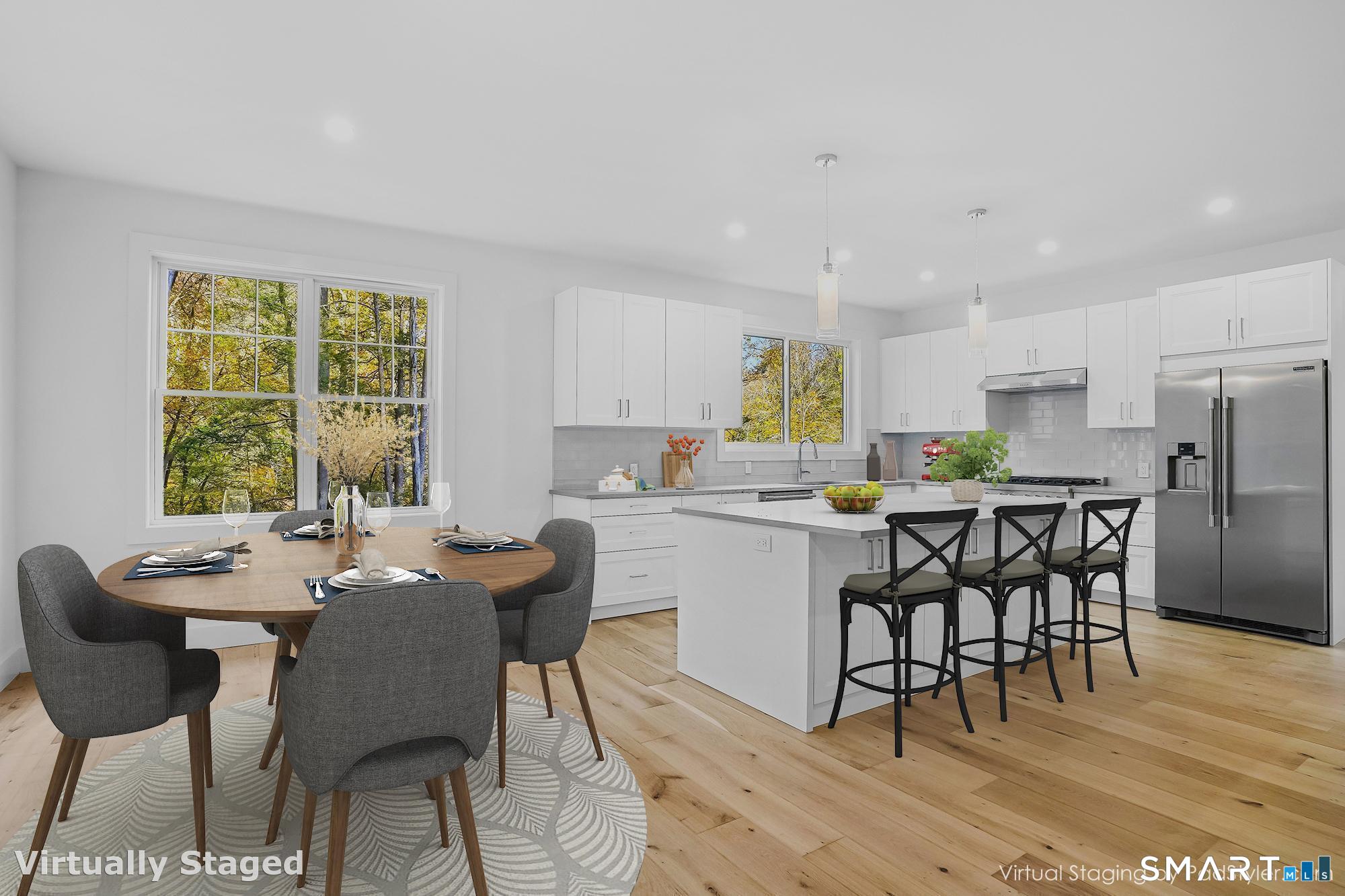 309 South Britain Road Southbury, CT 06488 - Photo 6 of 25 Center island with quartz counters as viewed from the family room