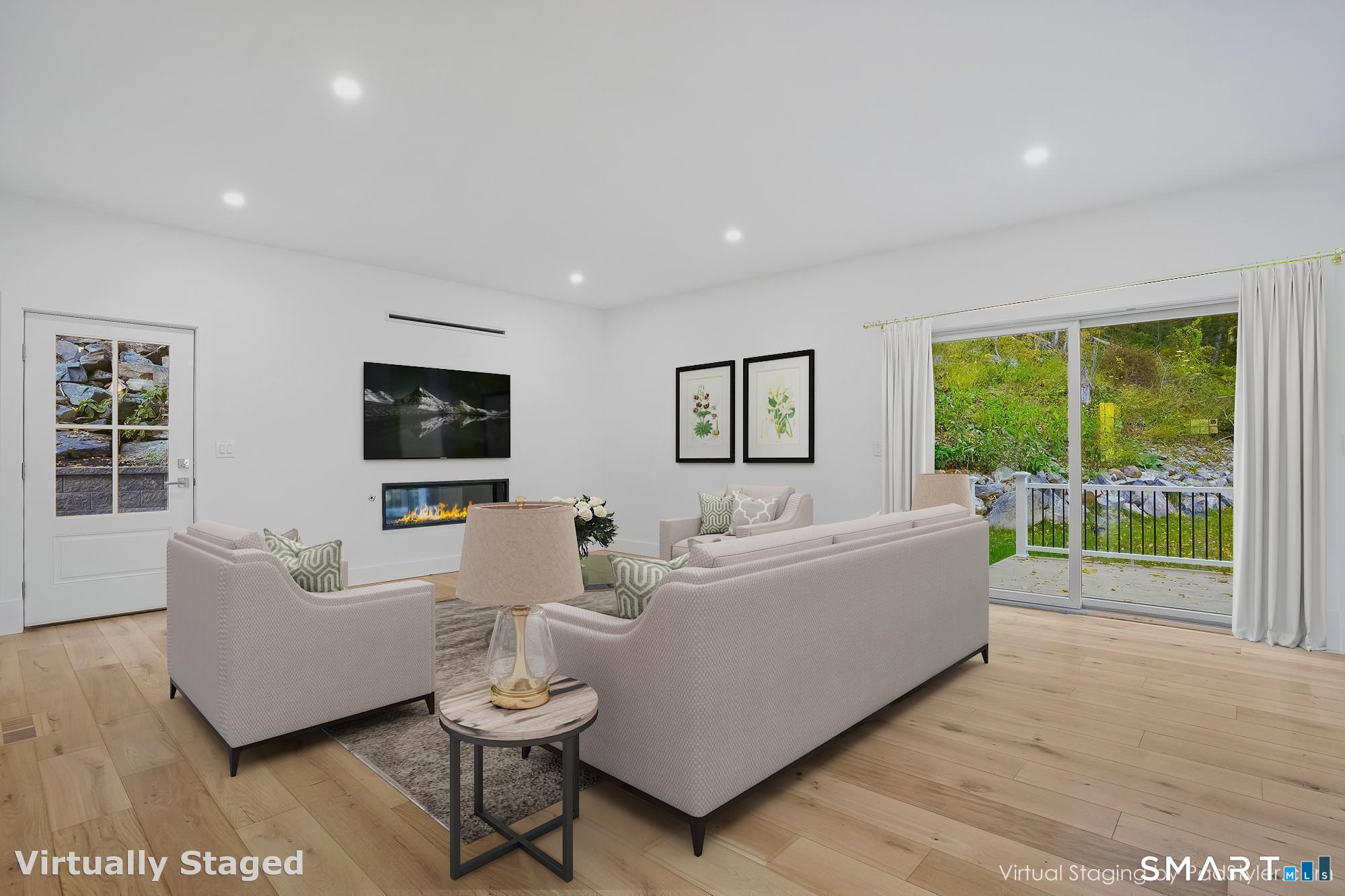 309 South Britain Road Southbury, CT 06488 - Photo 9 of 25 Family room with gas fireplace and sliders to a private deck