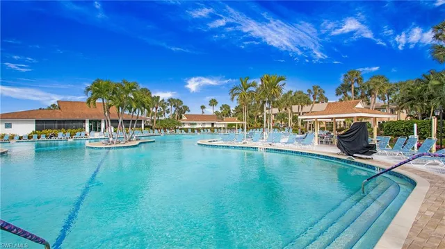 a view of an swimming pool with outdoor seating