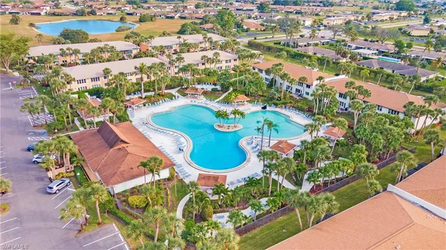 an aerial view of residential house with outdoor space and swimming pool