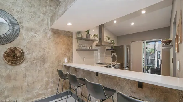a kitchen with a table and chairs