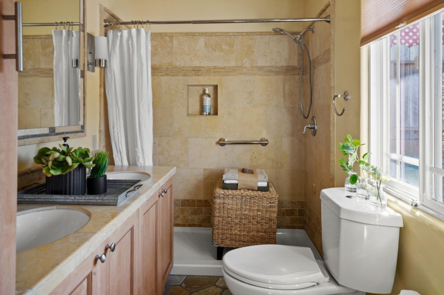 1717 Harding Street Seaside, CA 93955 - Photo 17 of 28 a bathroom with a granite countertop sink a toilet and shower