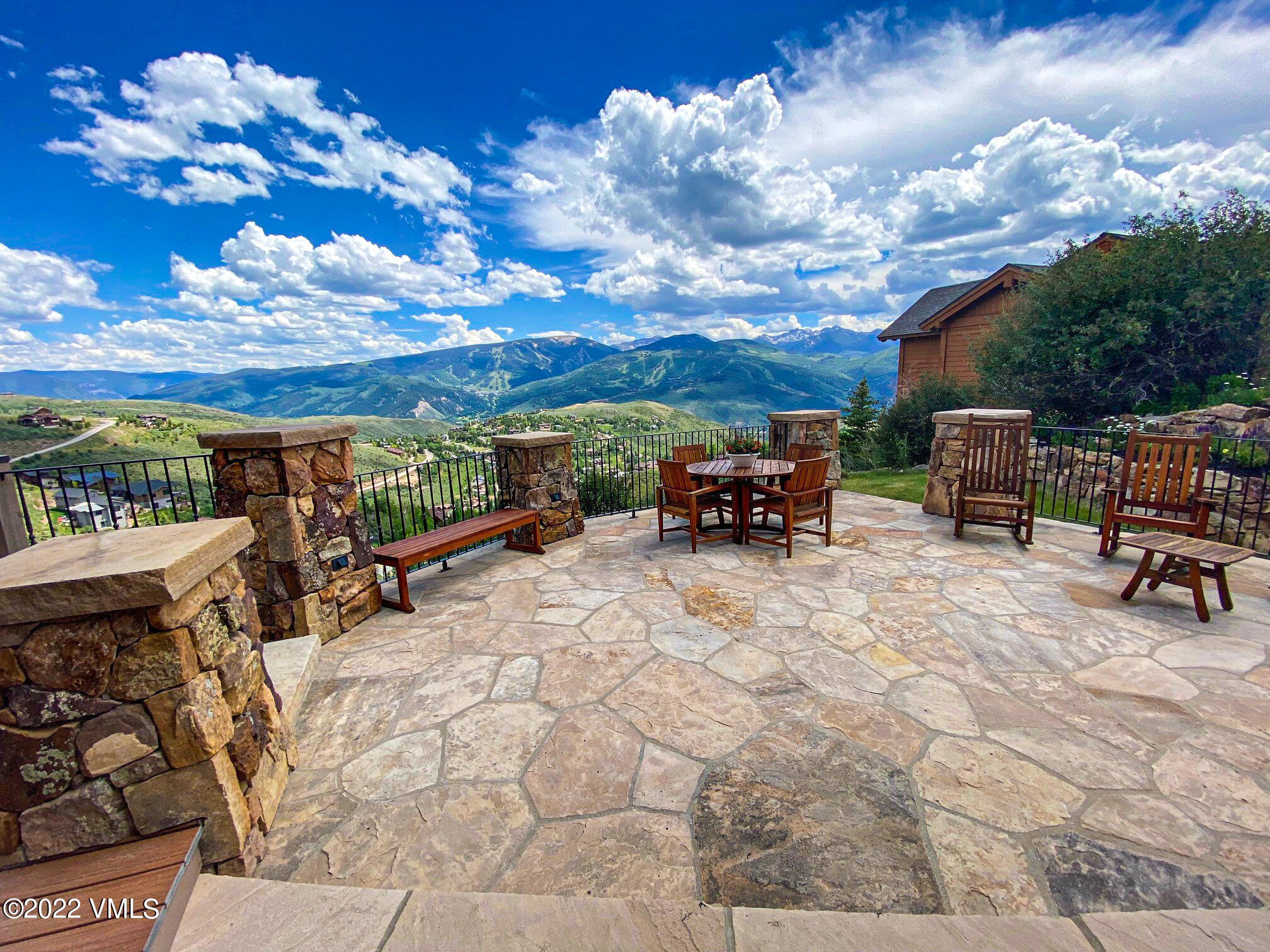 a view of the terrace with couches and sky view