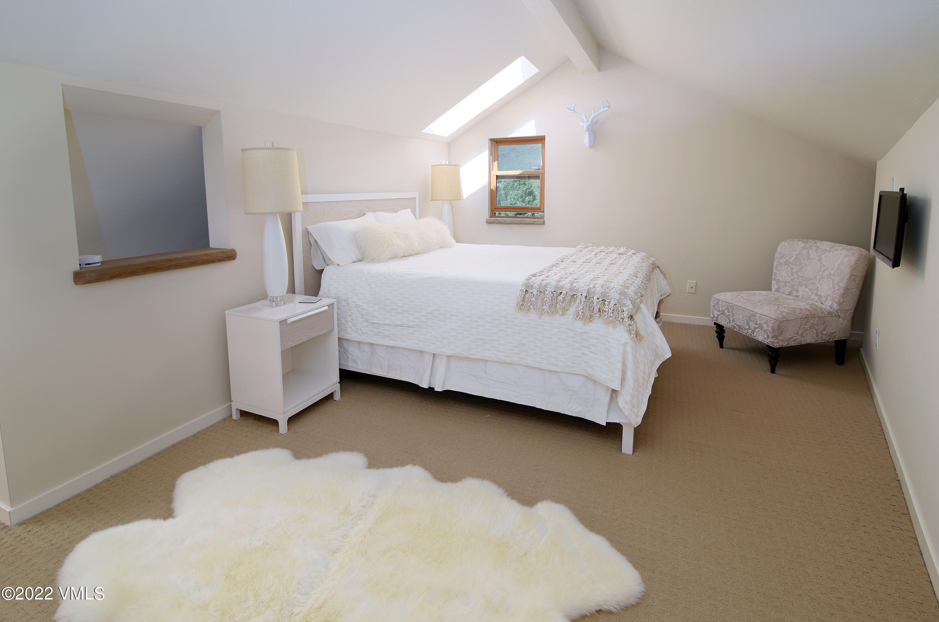 4530 Flat Point, Unit A Avon, CO 81620 - Photo 14 of 22 a bedroom with bed and window