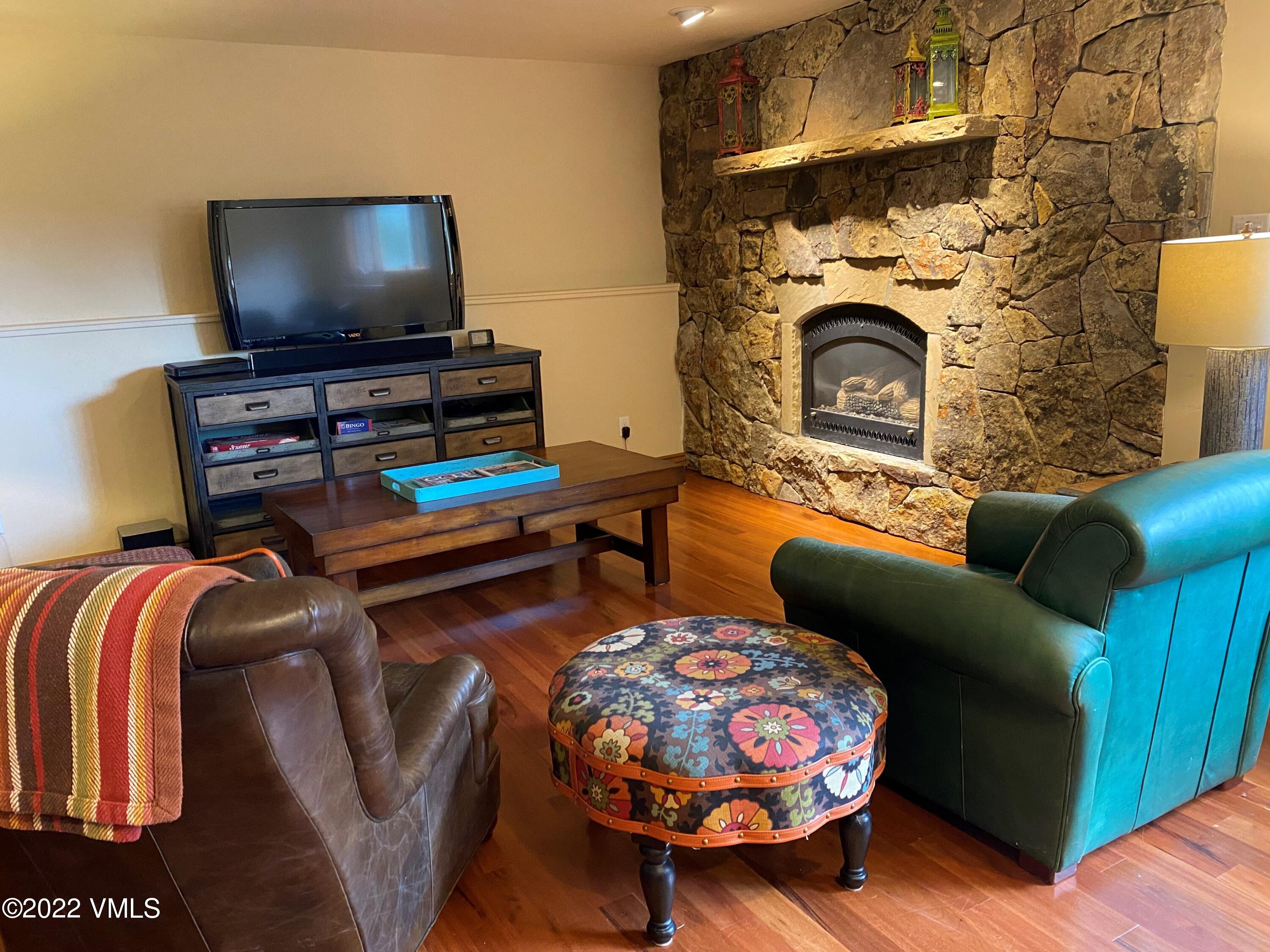 4530 Flat Point, Unit A Avon, CO 81620 - Photo 22 of 22 a living room with furniture and a flat screen tv