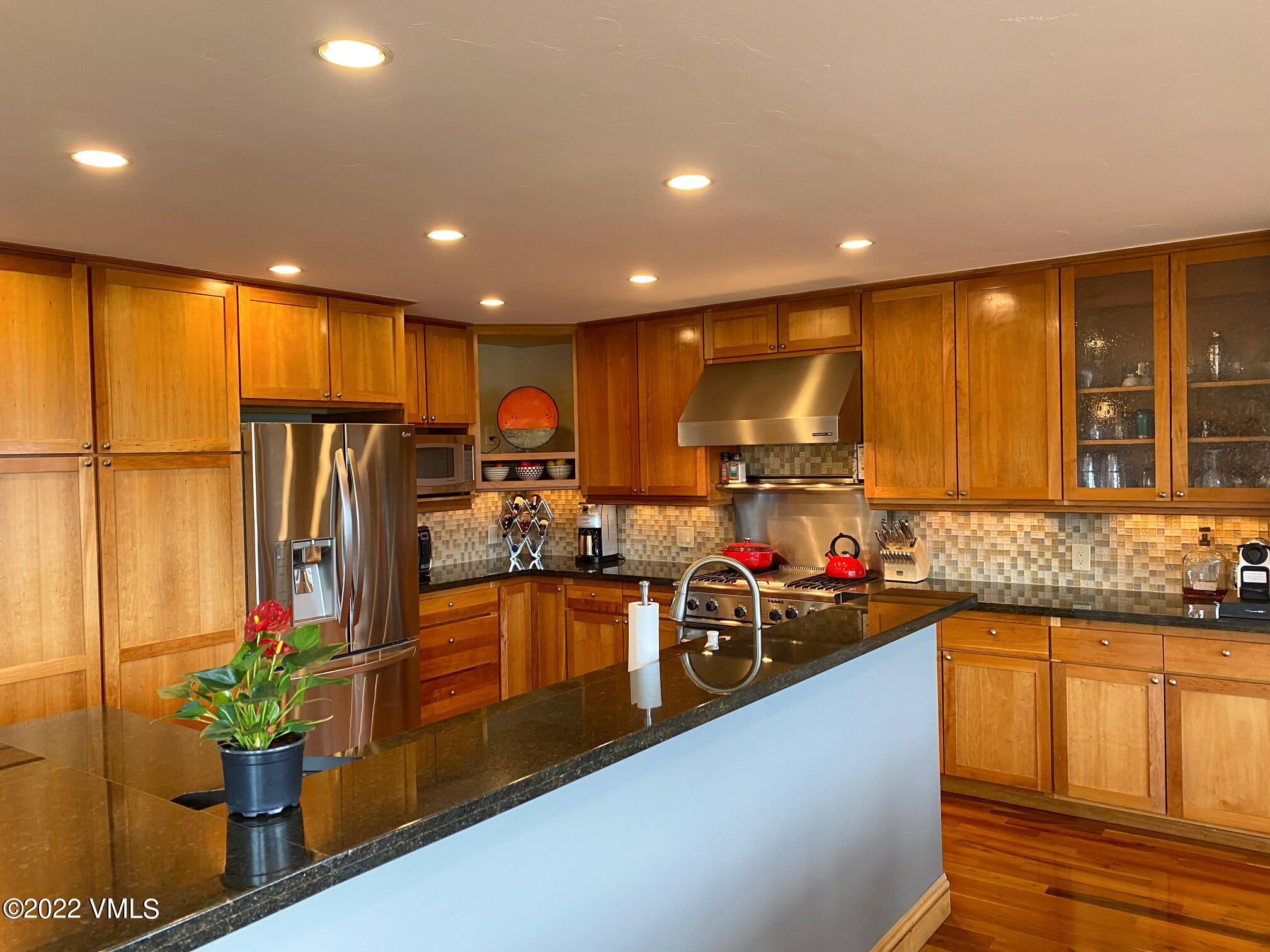 4530 Flat Point, Unit A Avon, CO 81620 - Photo 6 of 22 a kitchen with sink refrigerator and microwave