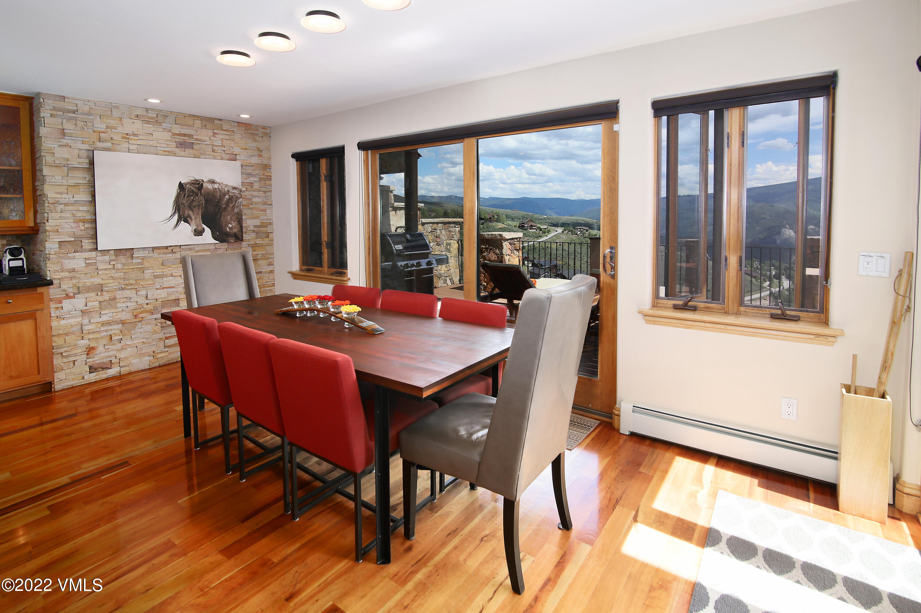 4530 Flat Point, Unit A Avon, CO 81620 - Photo 7 of 22 a view of a dining room with furniture window and wooden floor