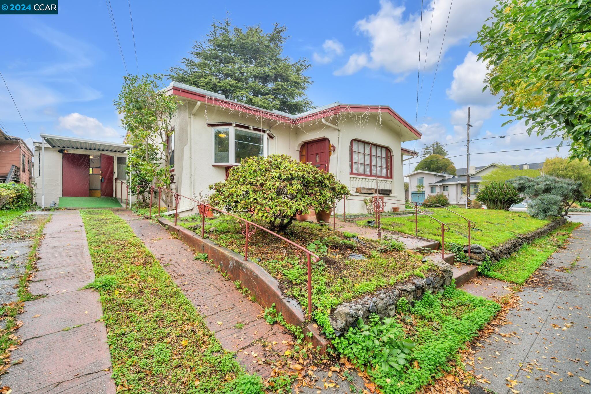 1345 Parker Street Berkeley, CA 94702 - Photo 1 of 1 a front view of a house with a yard