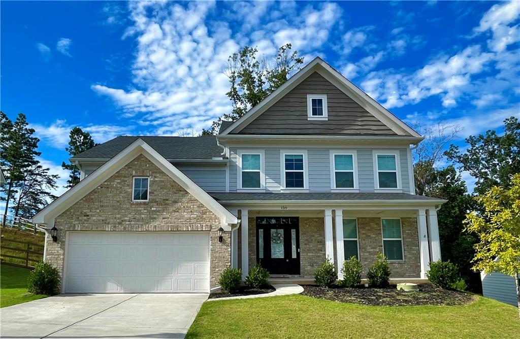 156 Greenbrier Way Canton, GA 30114 - Photo 1 of 1 a front view of a house with yard and green space