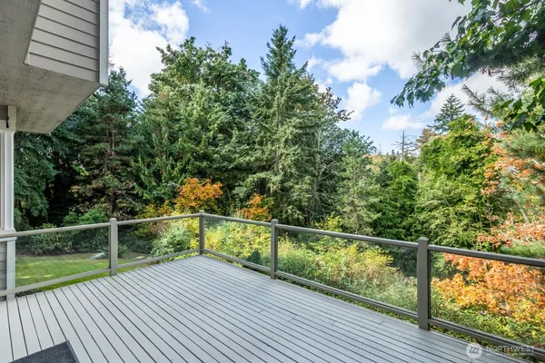 a view of a balcony with wooden floor