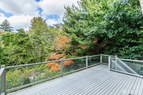 a view of a balcony with wooden floor
