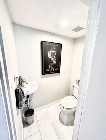 a bedroom with a bed and a television