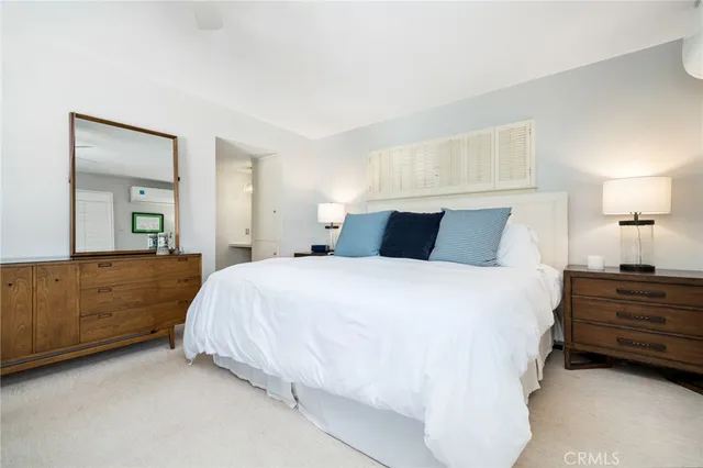 a bedroom with bed and window