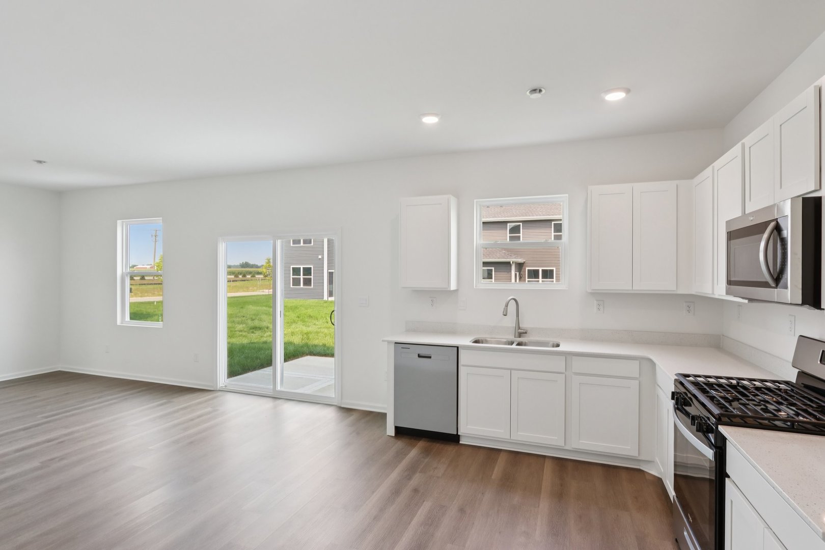 1271 Acadia Circle Pingree Grove, IL 60140 - Photo 5 of 36 a kitchen with a sink stove and cabinets