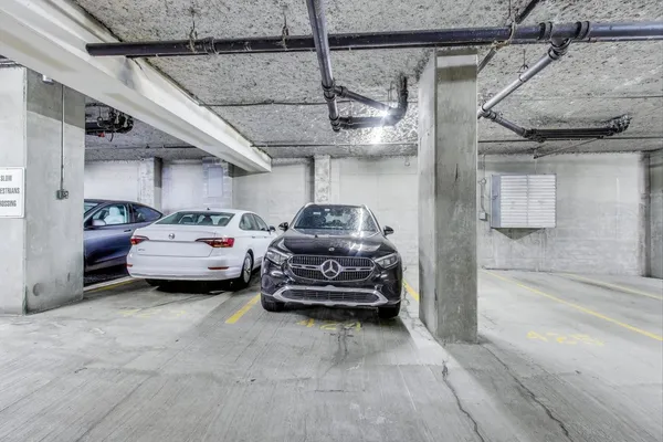 a utility room with a car parked