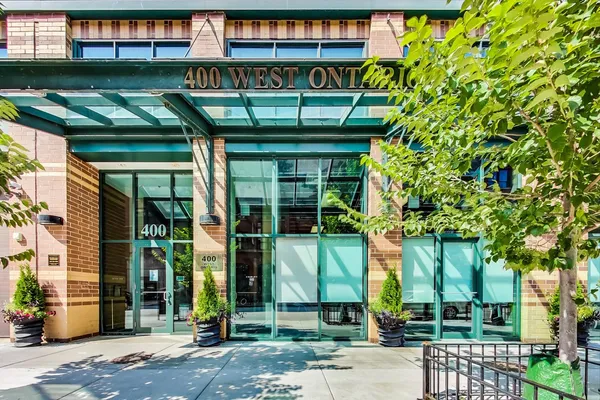 a front view of a building with glass windows and door