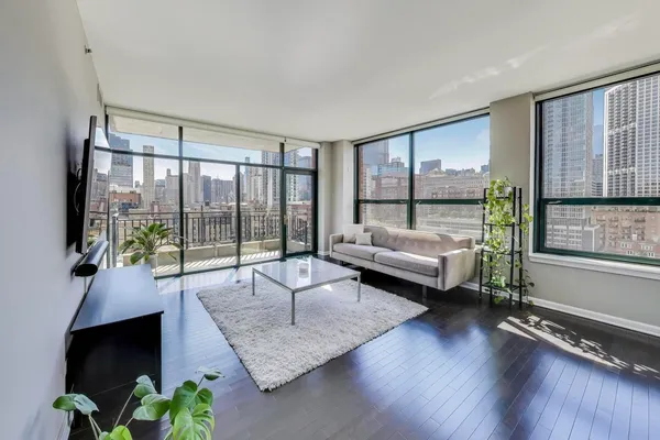 a living room with furniture and a large window