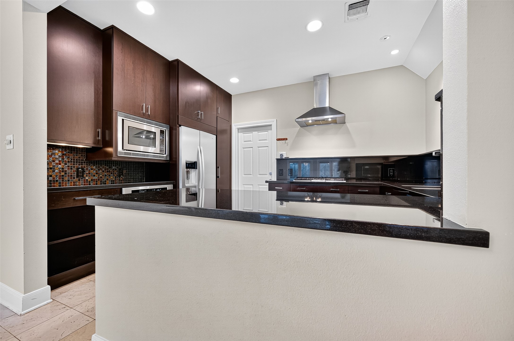 3027 Bissonnet Street Houston, TX 77005 - Photo 14 of 47 Chef's kitchen with upgraded dark cabinetry and plenty of counter space