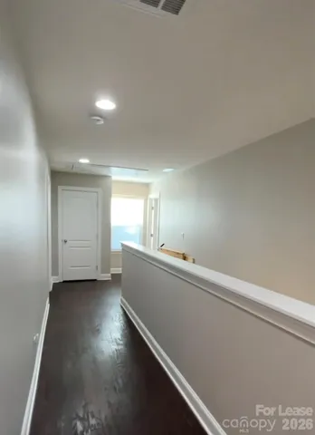 a room with a window and wooden floor