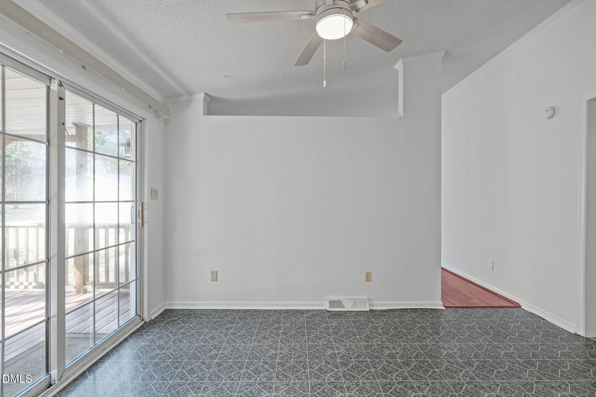 7900 Barbour Store Road Willow Spring, NC 27592 - Photo 11 of 38 an empty room with windows