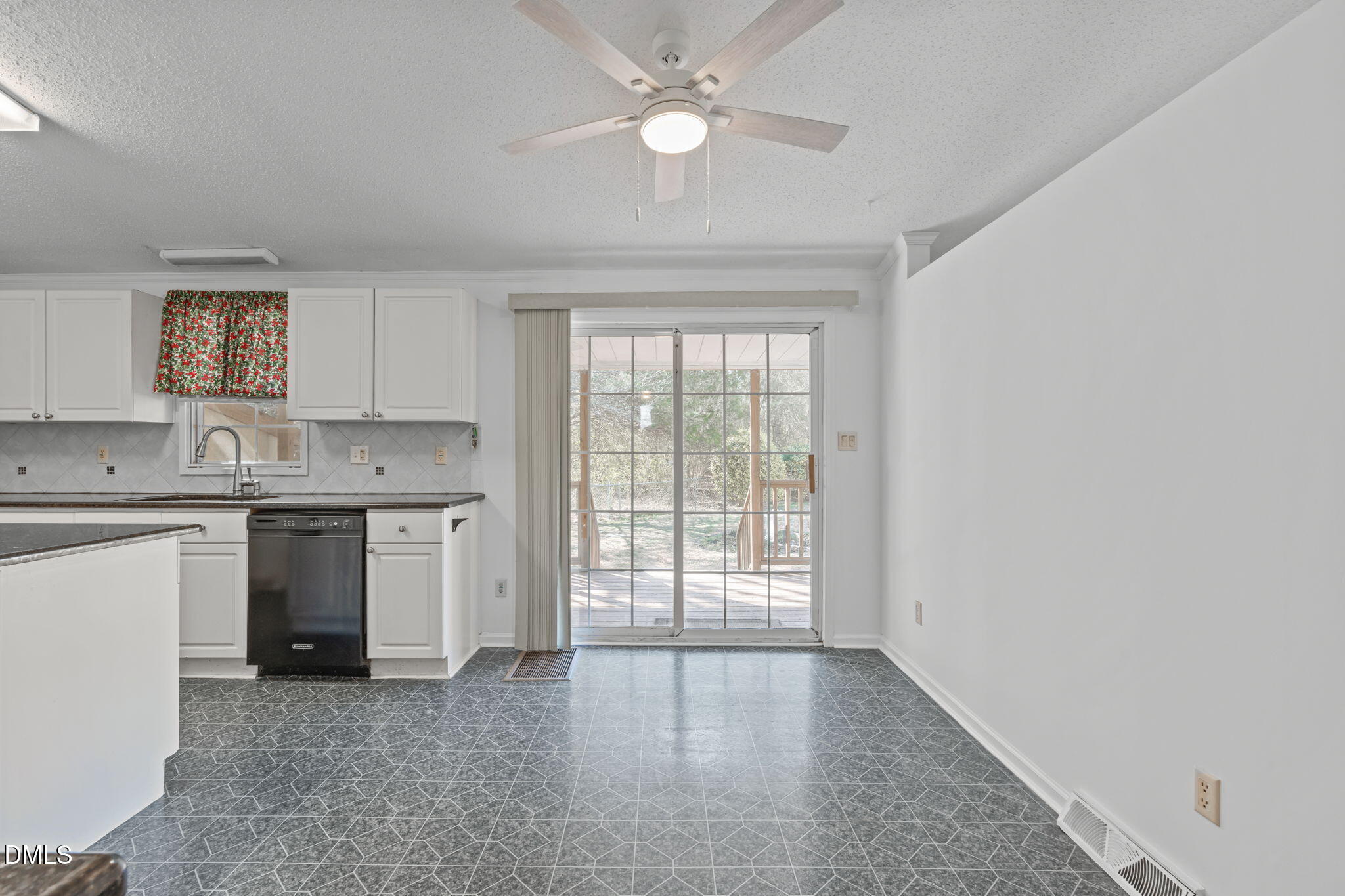 7900 Barbour Store Road Willow Spring, NC 27592 - Photo 12 of 38 a view of a kitchen with a sink and dishwasher a kitchen view