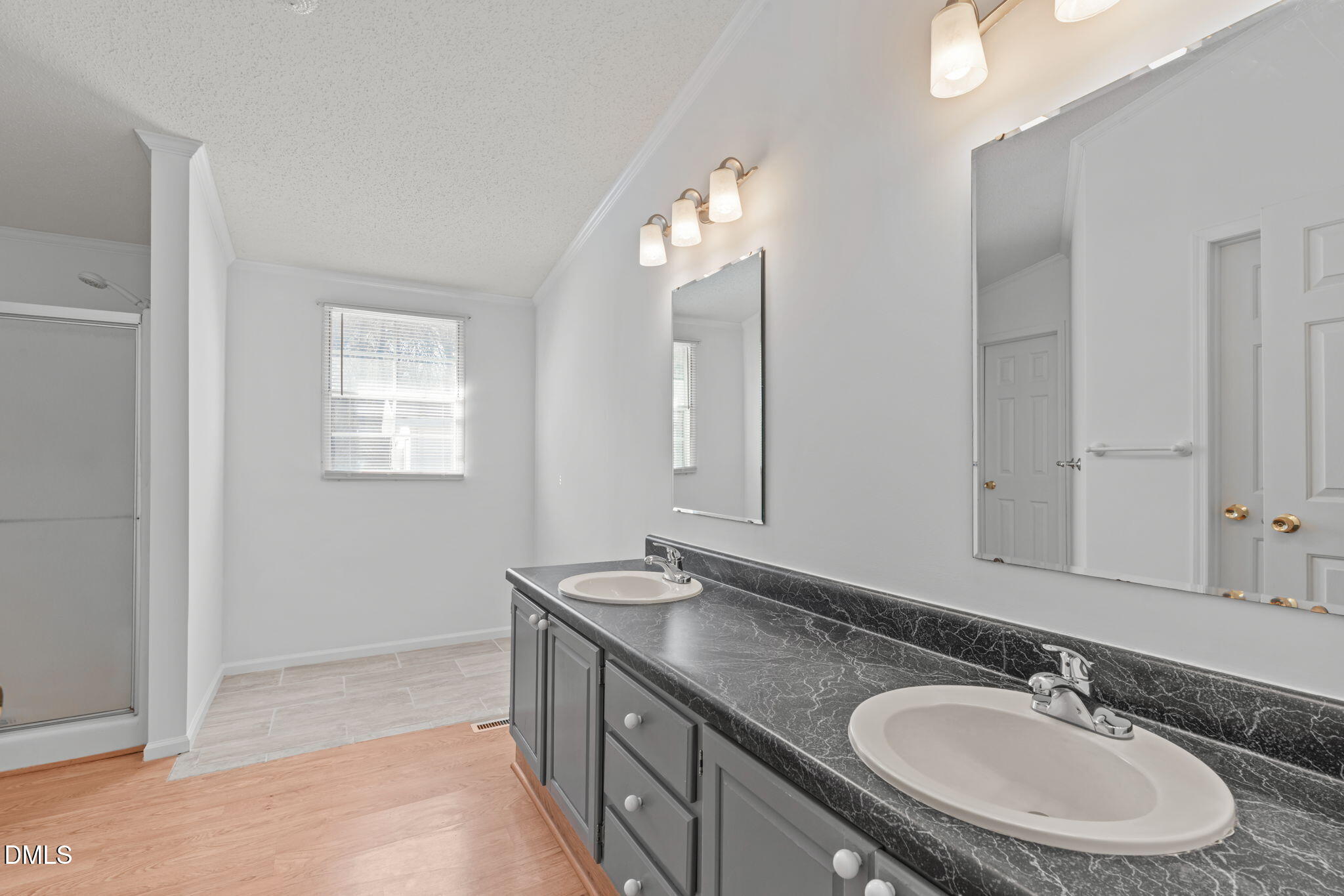7900 Barbour Store Road Willow Spring, NC 27592 - Photo 15 of 38 a bathroom with a granite countertop sink and a mirror