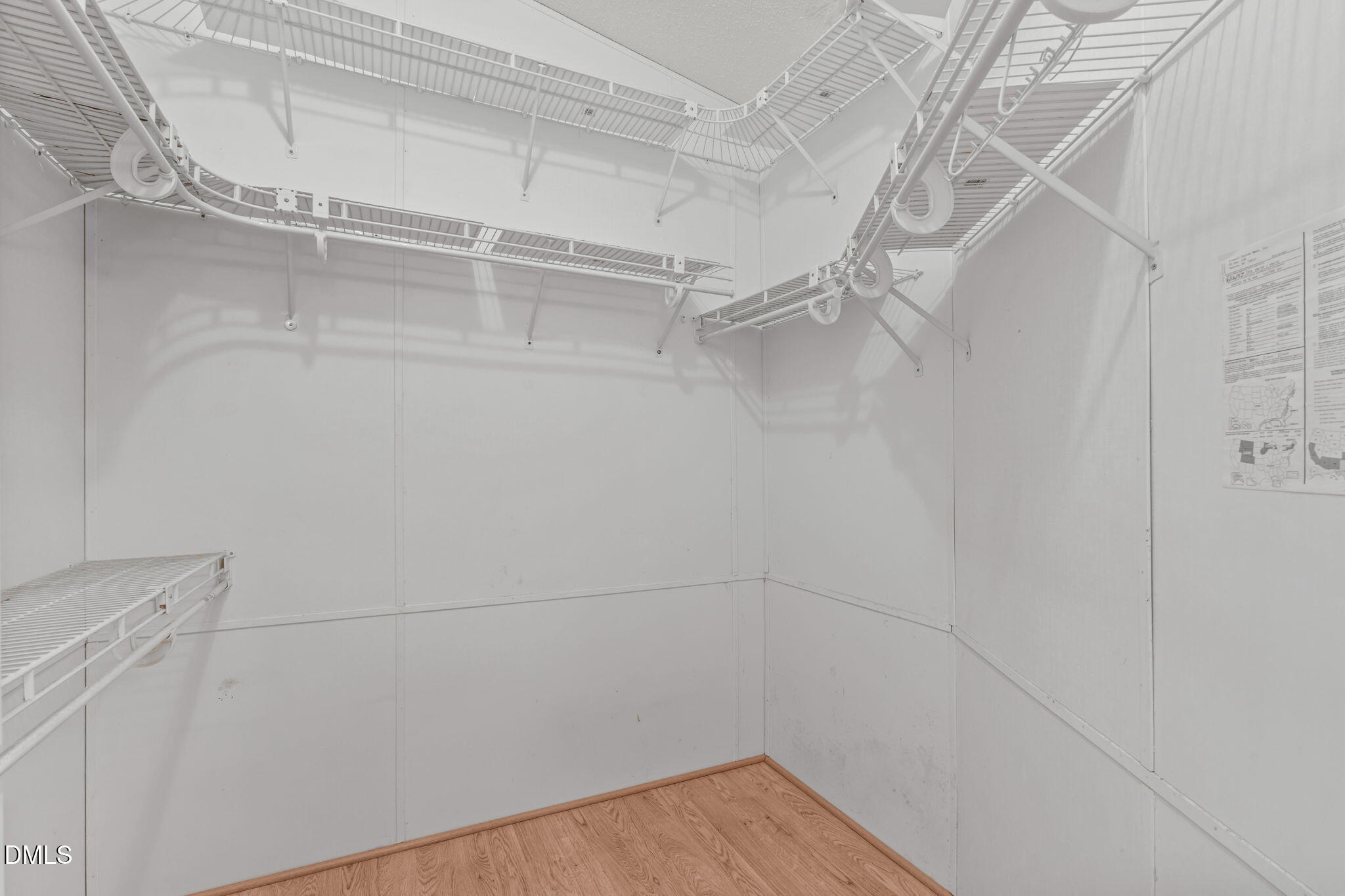 7900 Barbour Store Road Willow Spring, NC 27592 - Photo 18 of 38 a view of a room with racks on the wall