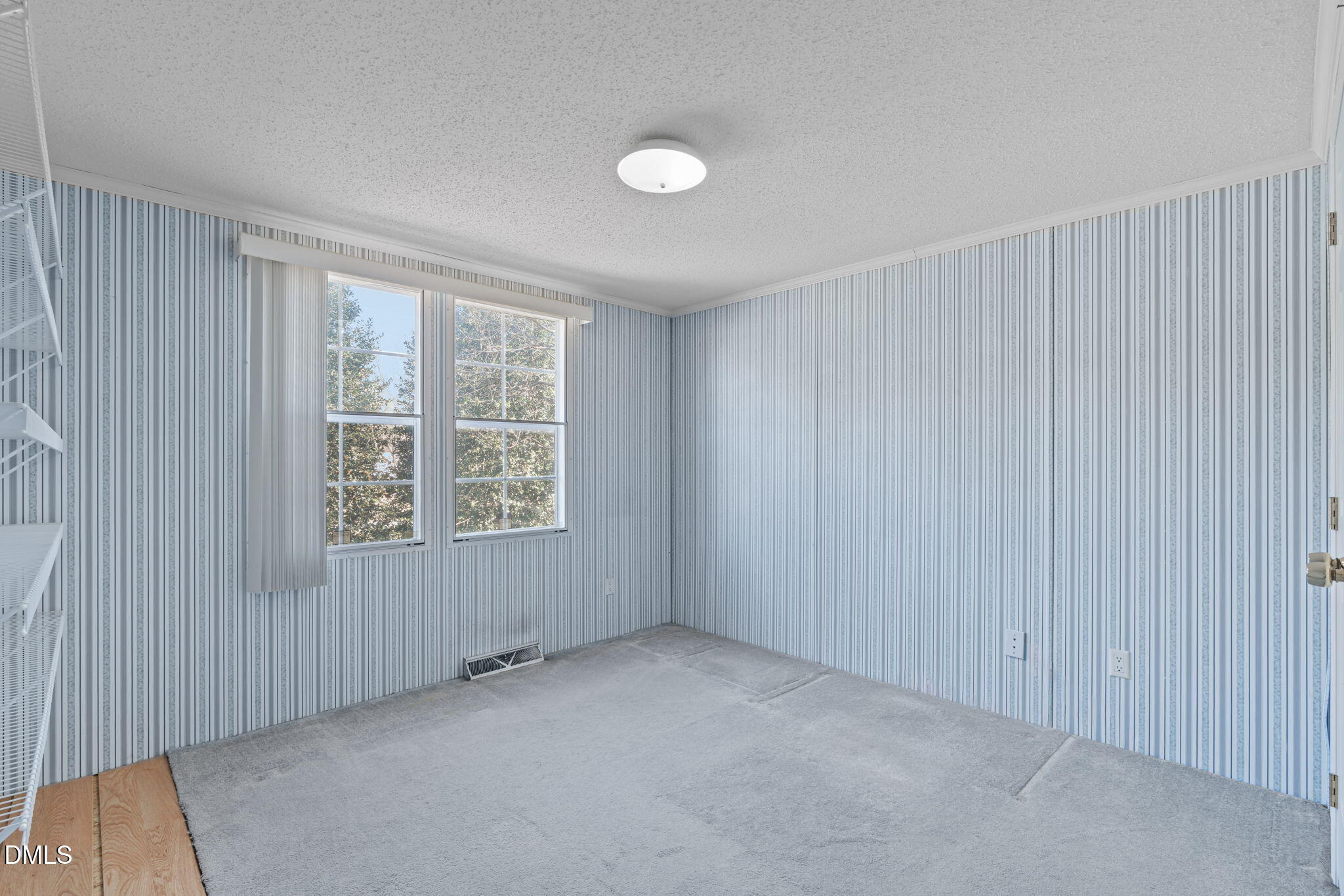 7900 Barbour Store Road Willow Spring, NC 27592 - Photo 19 of 38 an empty room with windows