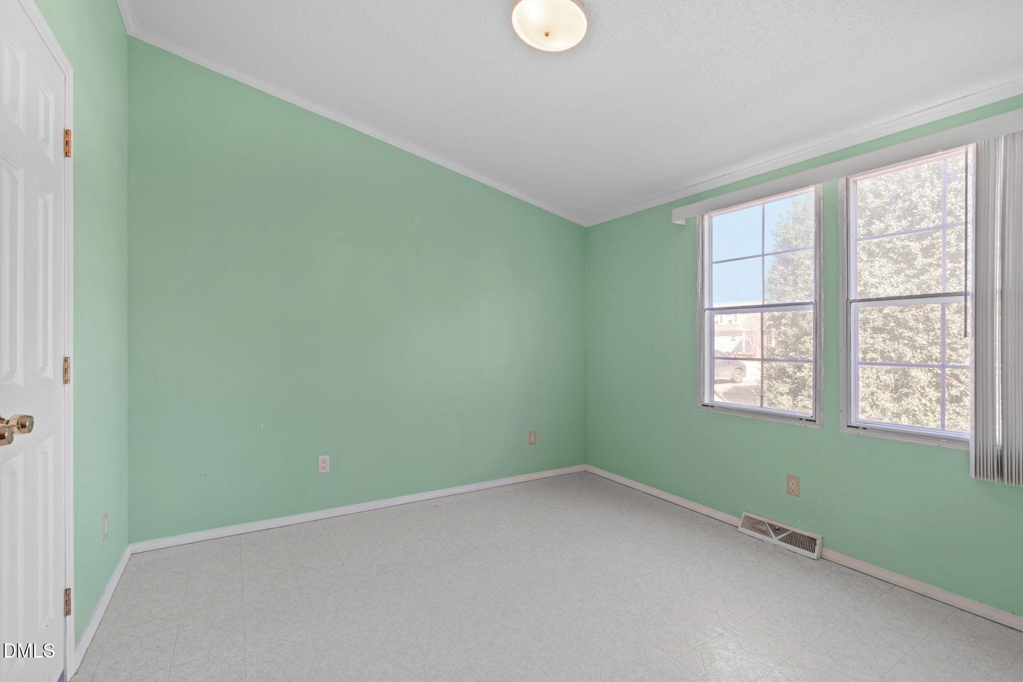 7900 Barbour Store Road Willow Spring, NC 27592 - Photo 21 of 38 a view of an empty room with a window
