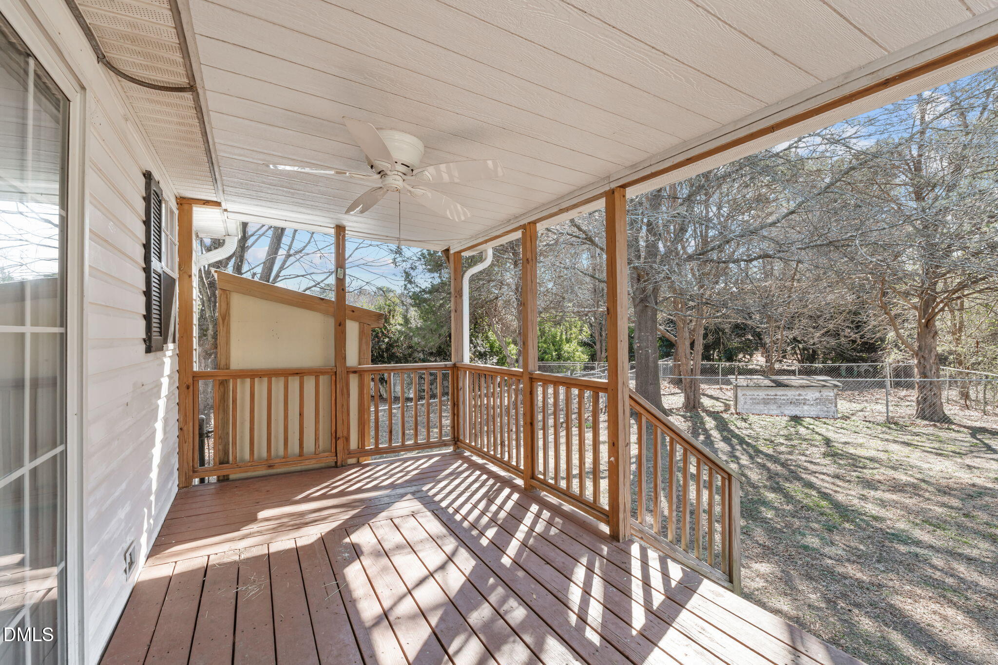 7900 Barbour Store Road Willow Spring, NC 27592 - Photo 25 of 38 a view of a porch with wooden floor and outdoor space