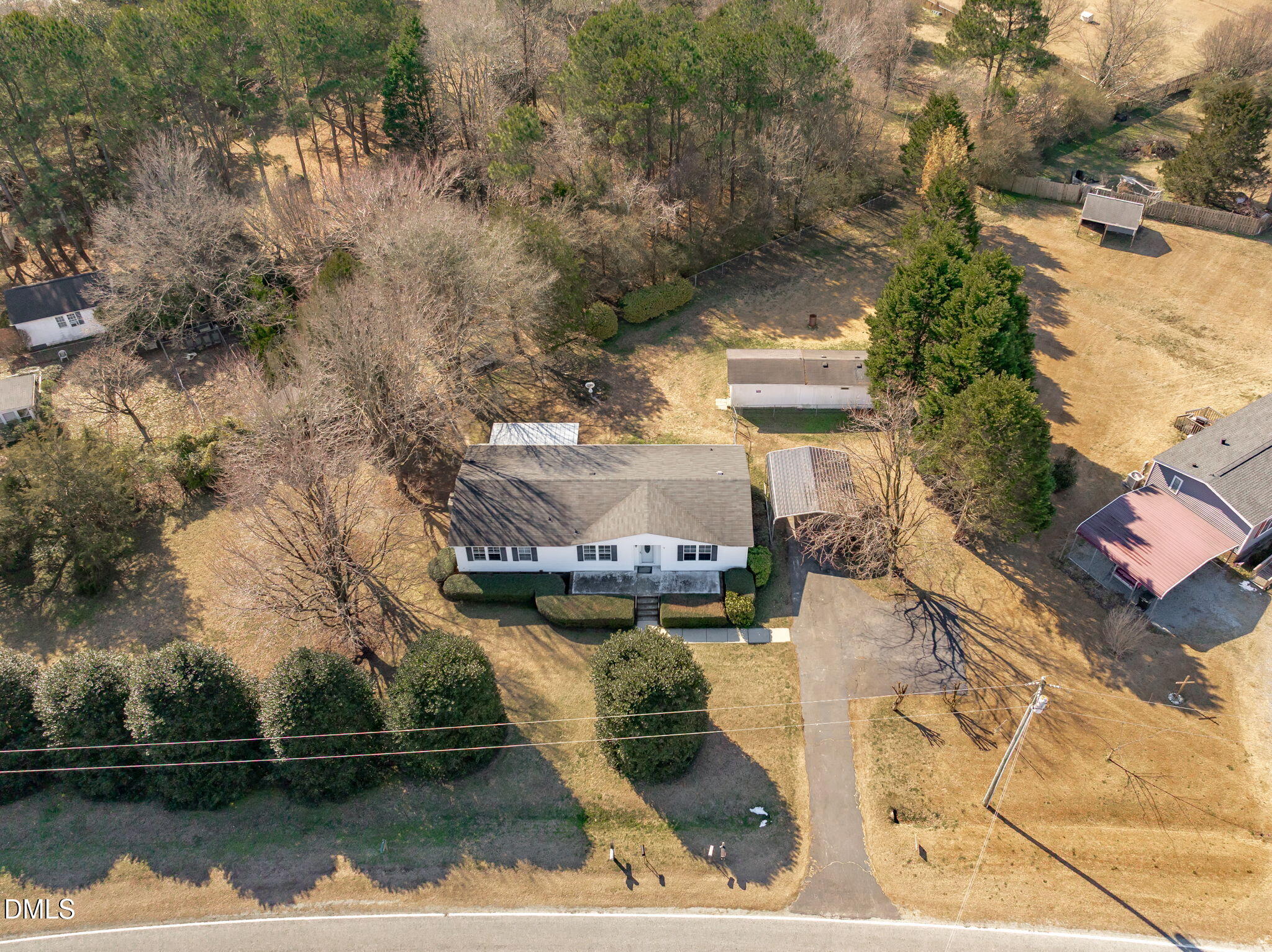 7900 Barbour Store Road Willow Spring, NC 27592 - Photo 38 of 38 a view of a lake with a house in the background