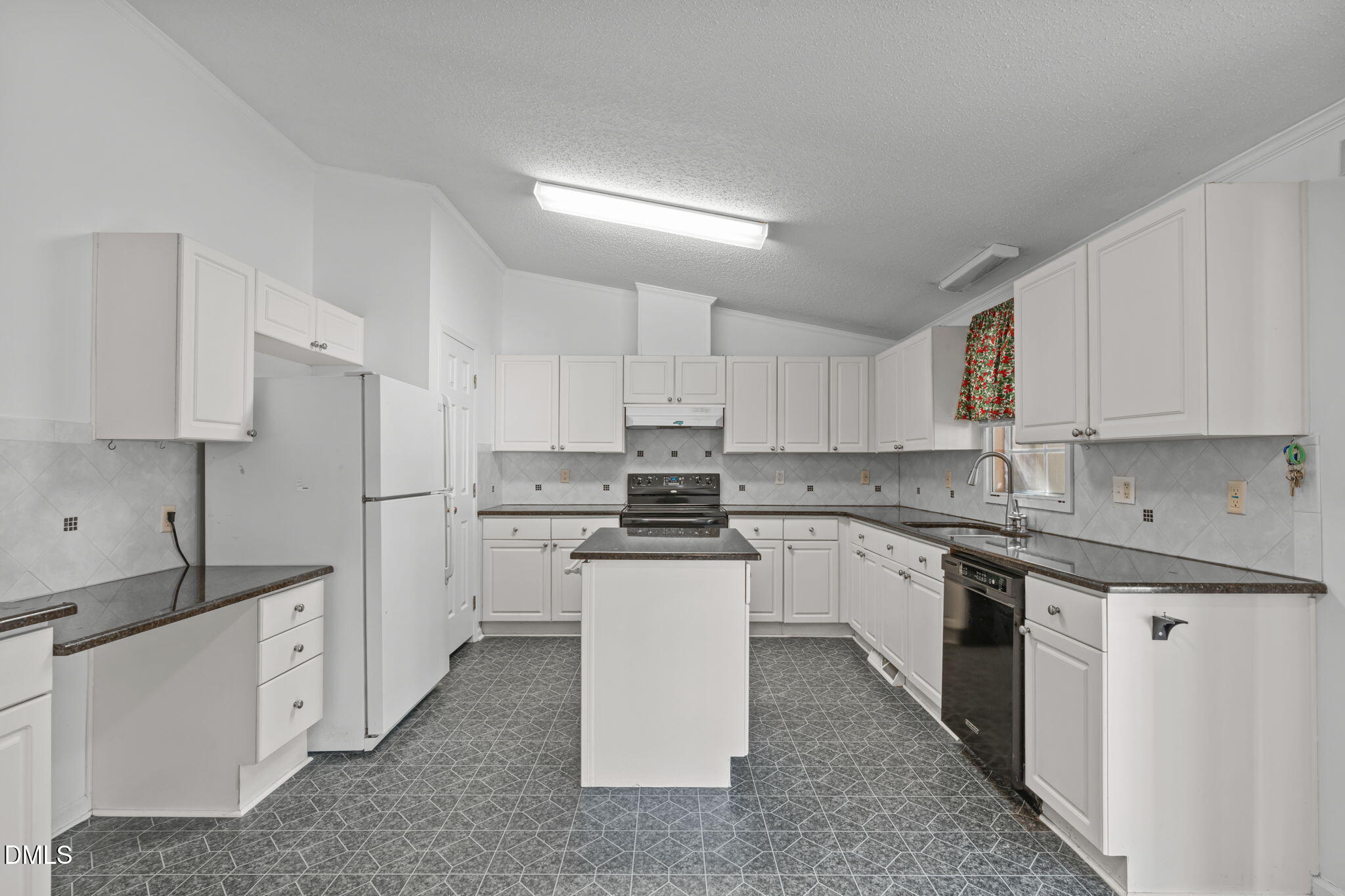7900 Barbour Store Road Willow Spring, NC 27592 - Photo 7 of 38 a kitchen with a sink stove and refrigerator