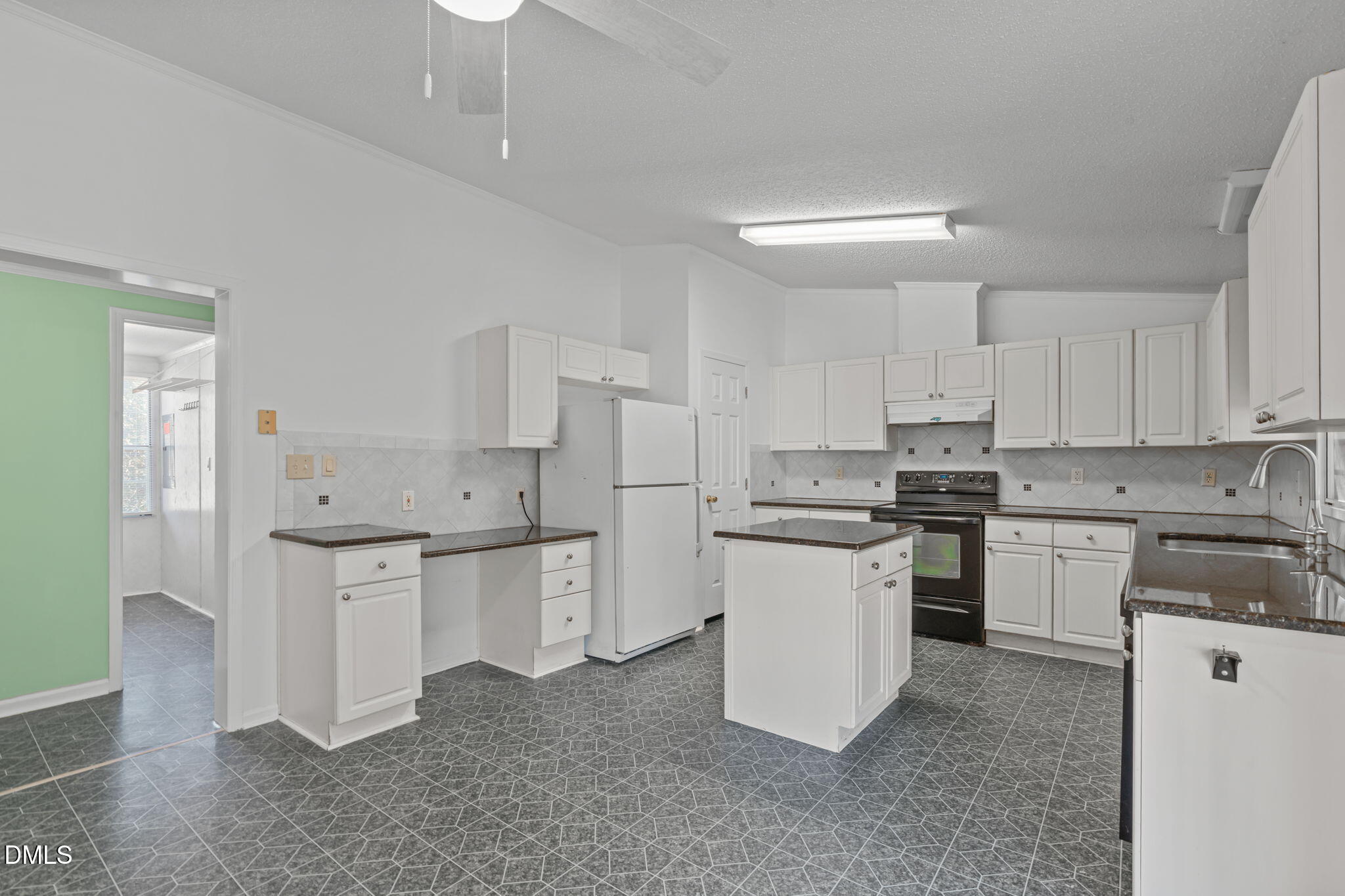 7900 Barbour Store Road Willow Spring, NC 27592 - Photo 8 of 38 a kitchen with granite countertop white cabinets and white appliances