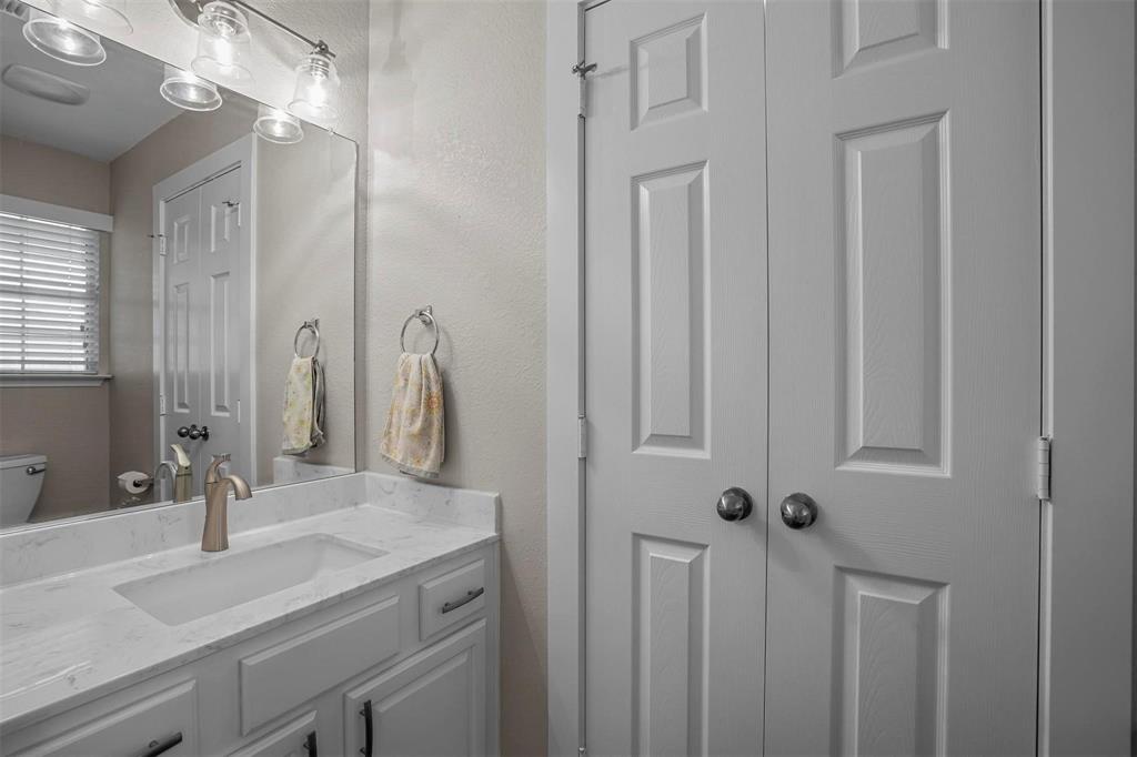 5113 Mountain Spring Trail Fort Worth, TX 76123 - Photo 15 of 35 a bathroom with a double vanity sink and a mirror