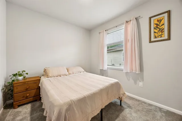 a bathroom with a shower and a sink