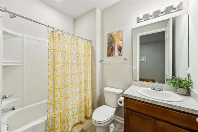 a bedroom with a bed and a shower