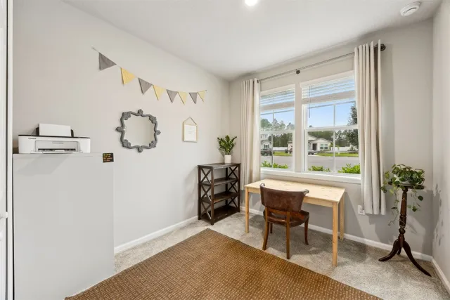 a bathroom with a sink a toilet and shower curtain
