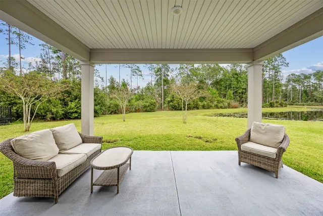 a view of a patio with a yard